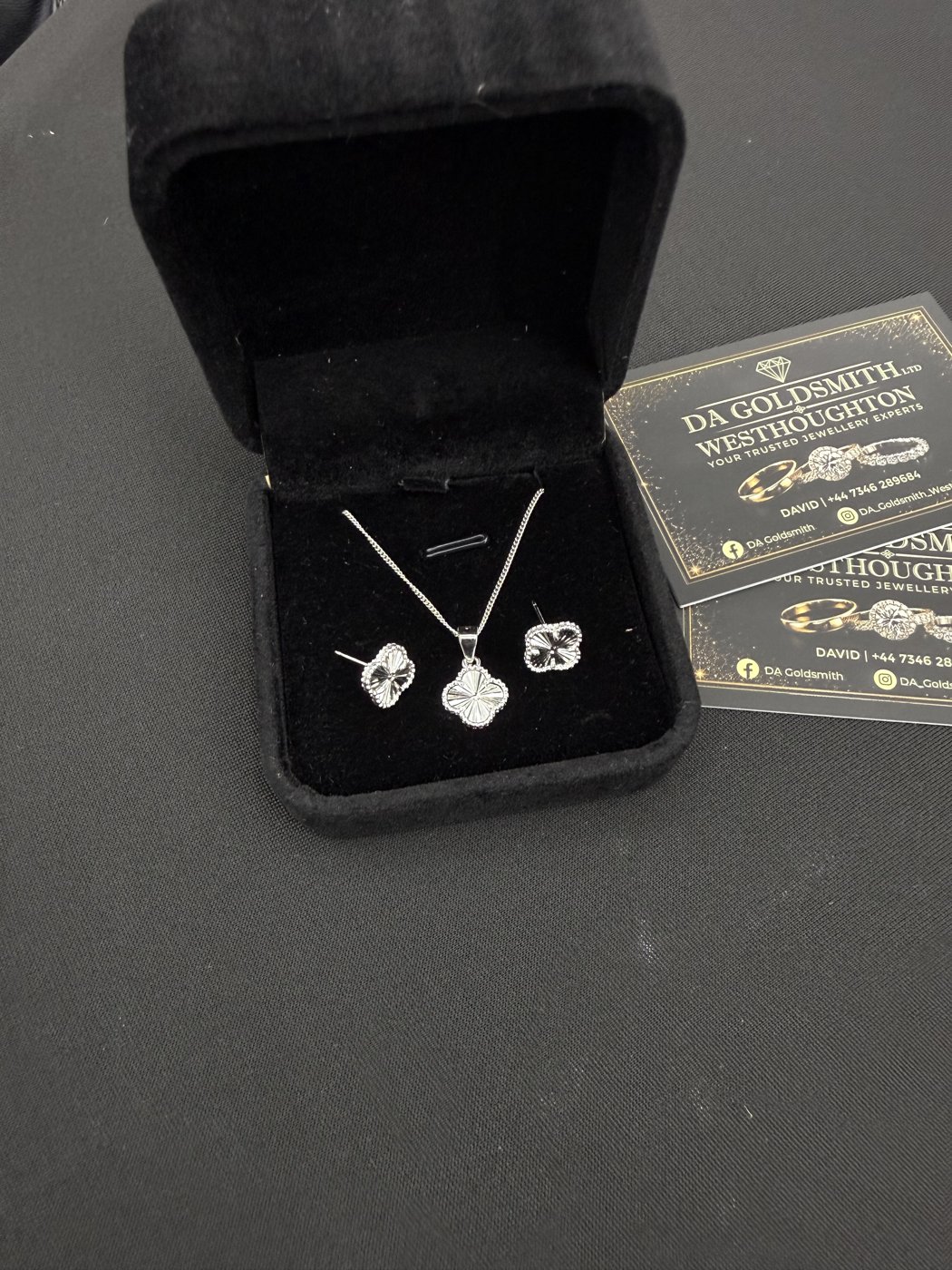 Heart pendant and earrings in an open jewellery box