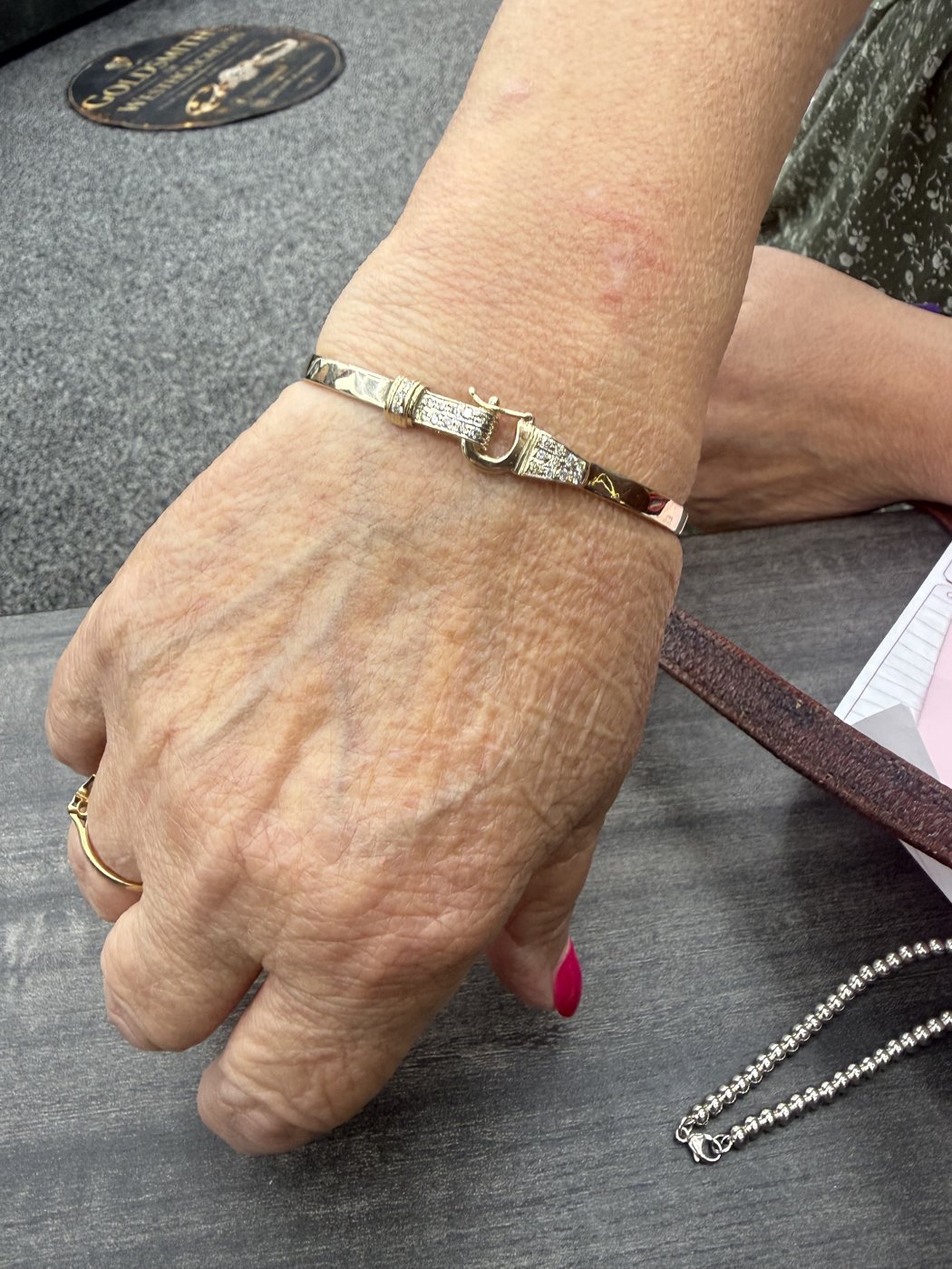 Metal bracelet worn on a wrist
