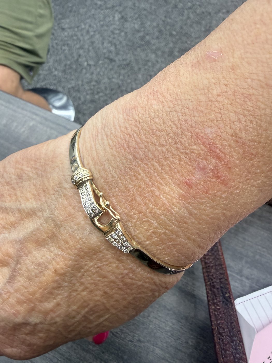 Metal bracelet worn on a wrist