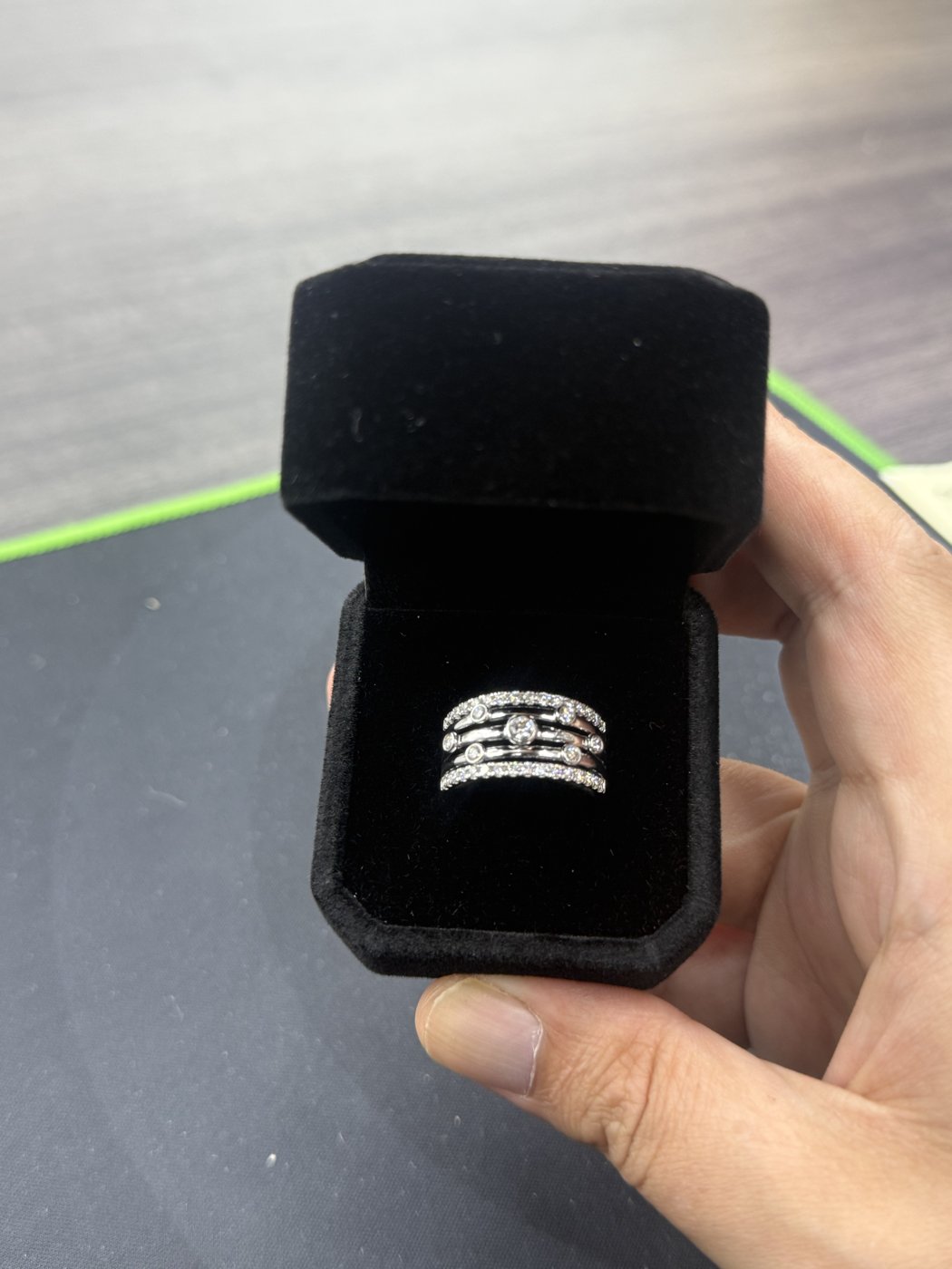 Stacked decorative bands presented in an open black box